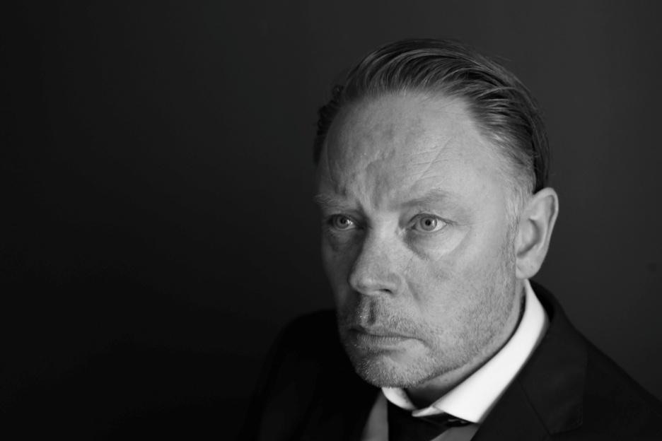 A person in a suit and tie<p>AI-generated content may
be
incorrect.